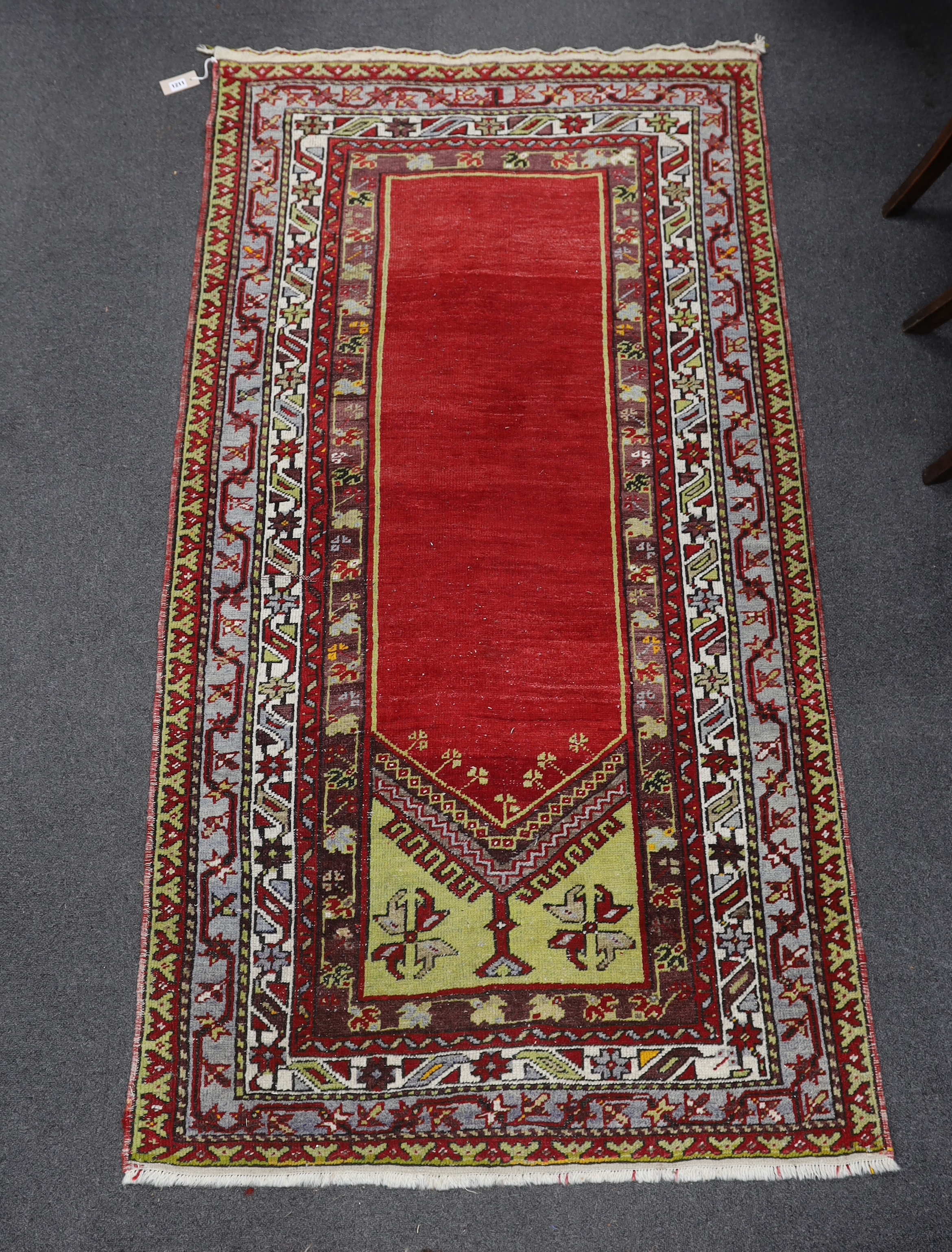 A Kesimuhsine Konya red ground prayer rug, 194 x 104cm